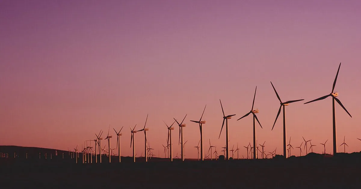 Wind turbines at sunset
